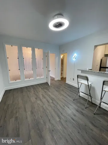 a view of a livingroom with furniture nad wooden floor