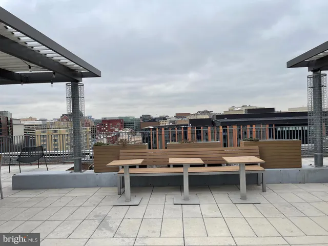 a terrace with a table and chairs