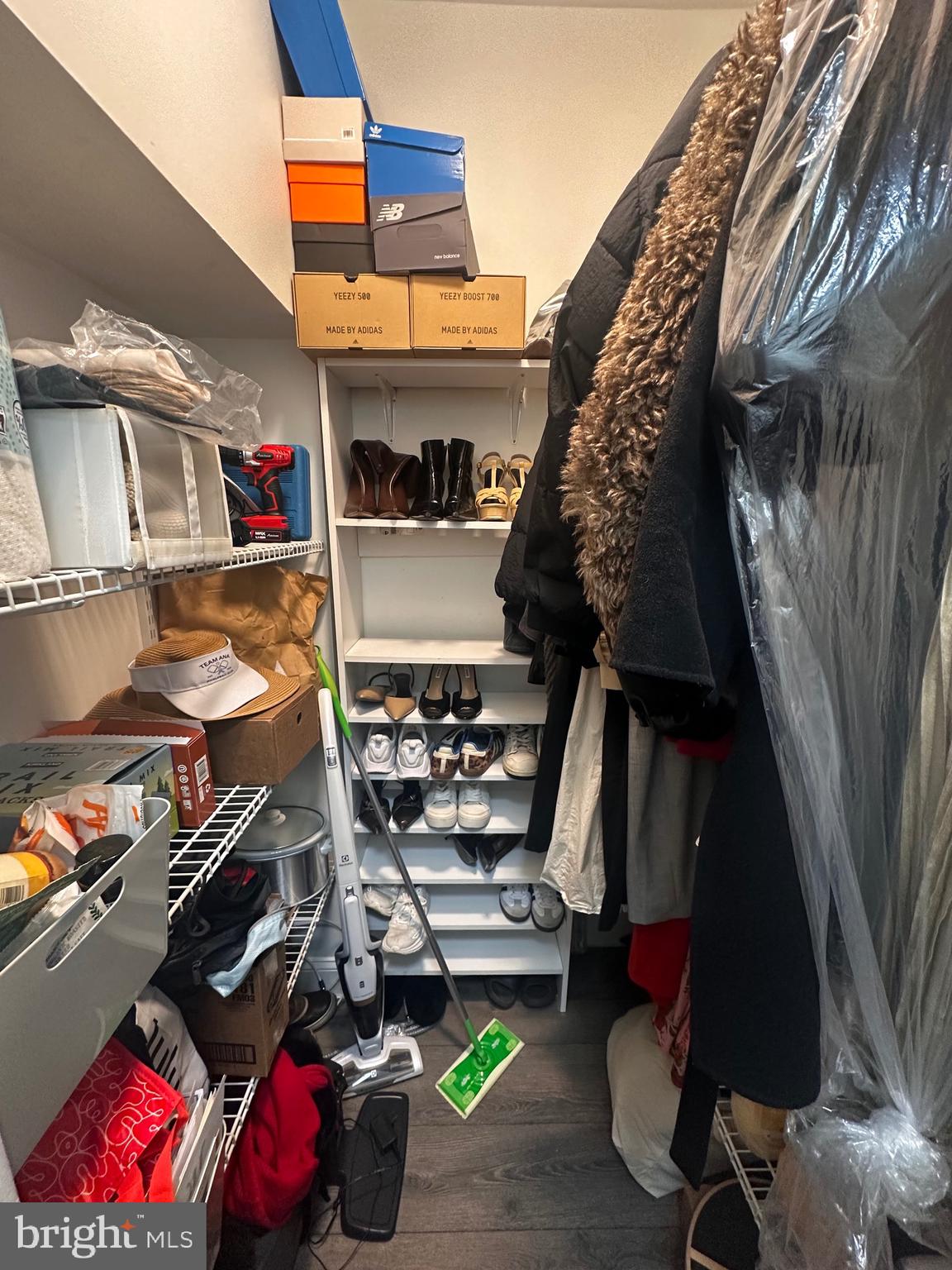 1 Scott Circle Northwest, Unit 118 Washington, DC 20036 - Photo 47 of 54 a view of walk in closet with clothes and shoes