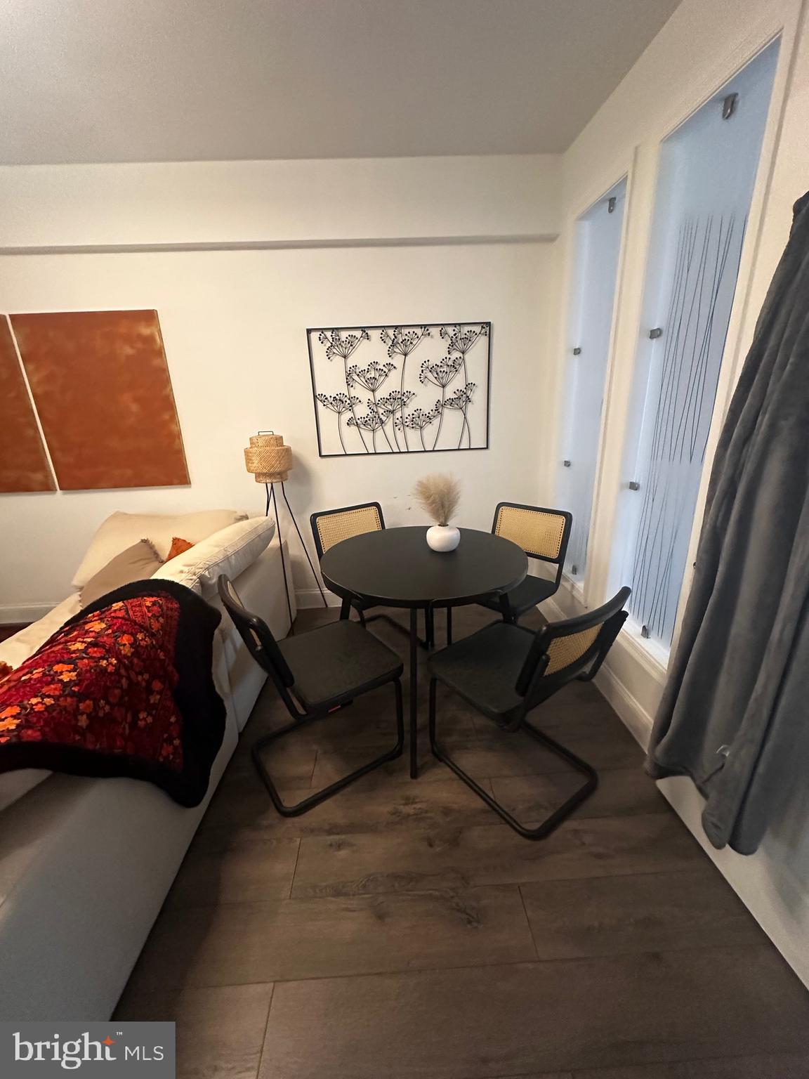 1 Scott Circle Northwest, Unit 118 Washington, DC 20036 - Photo 51 of 54 a living room with furniture and a window