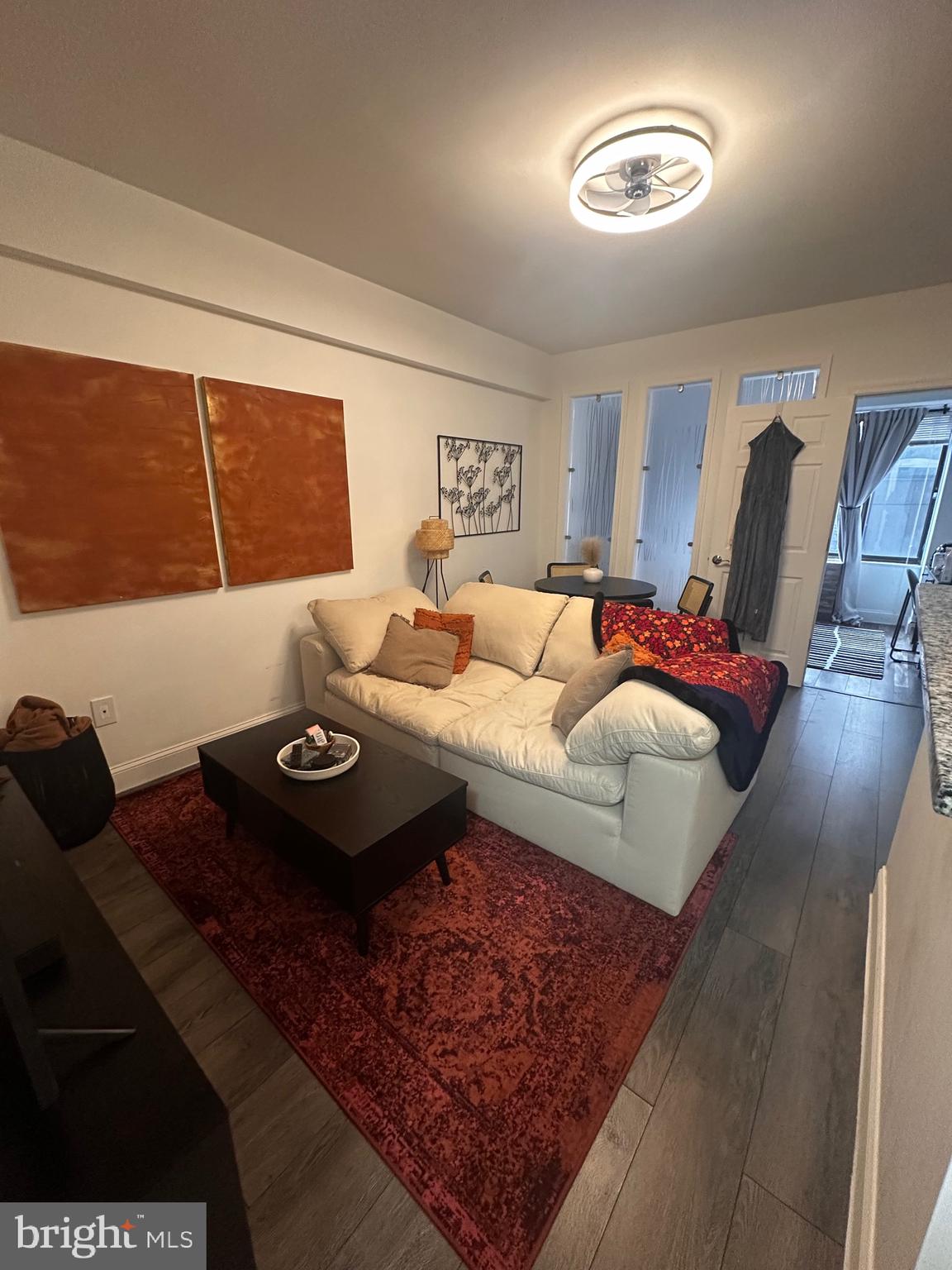 1 Scott Circle Northwest, Unit 118 Washington, DC 20036 - Photo 52 of 54 a living room with furniture rug and a window