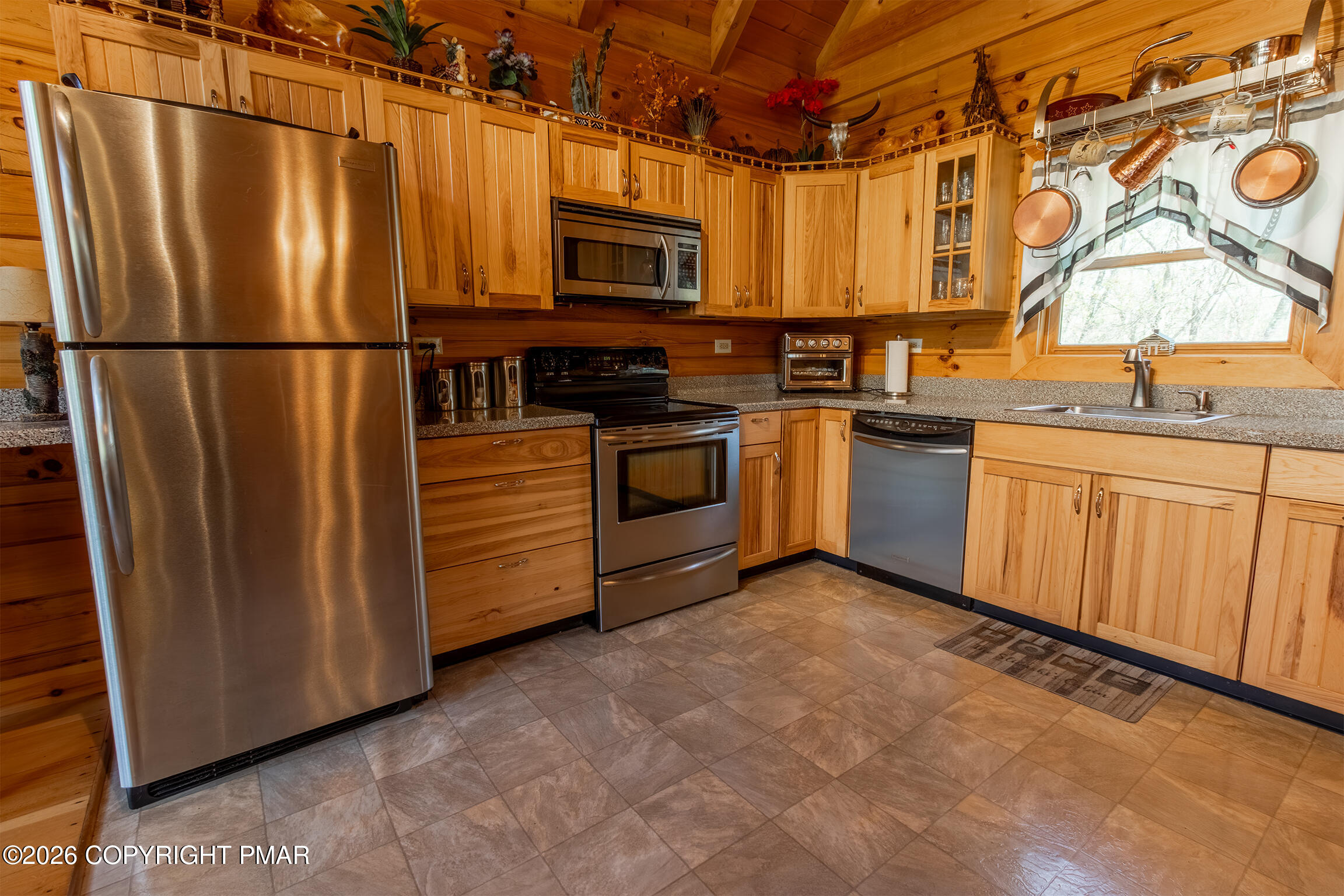 1160 Bluebird Lane Bushkill, PA 18324 - Photo 10 of 44 a kitchen with stainless steel appliances granite countertop a refrigerator and a stove top oven
