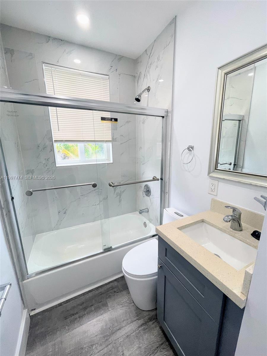 1036 Southwest 5th Street, Unit 8 Miami, FL 33130 - Photo 4 of 13 a bathroom with a sink a toilet and a bathtub