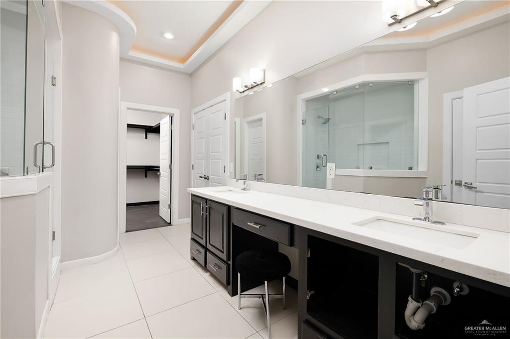 1014 Hill Country Road Edinburg, TX 78539 - Photo 13 of 31 a spacious bathroom with a double vanity sink double and mirror