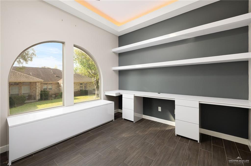 1014 Hill Country Road Edinburg, TX 78539 - Photo 16 of 31 a view of an empty room with a fireplace and a large window