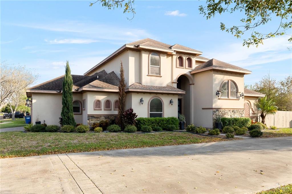 1014 Hill Country Road Edinburg, TX 78539 - Photo 2 of 31 a front view of a house with a yard