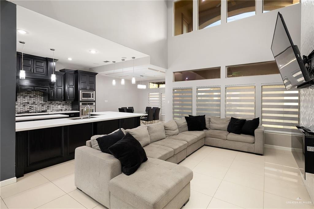 1014 Hill Country Road Edinburg, TX 78539 - Photo 5 of 31 a living room with fireplace furniture and a kitchen view