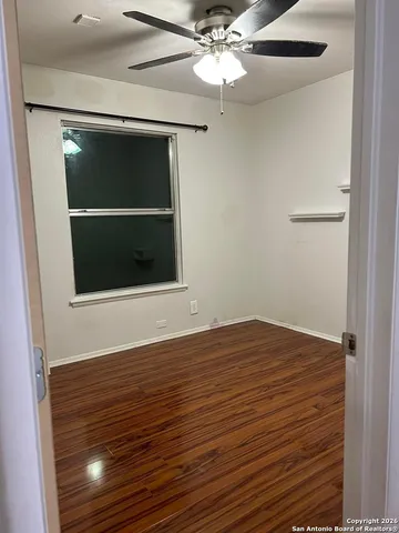 a view of an empty room with a bathroom