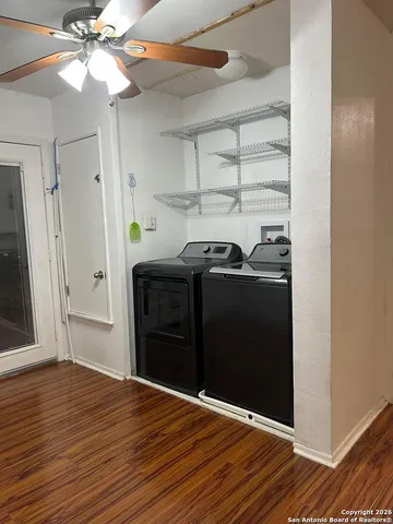 a view of a livingroom with wooden floor