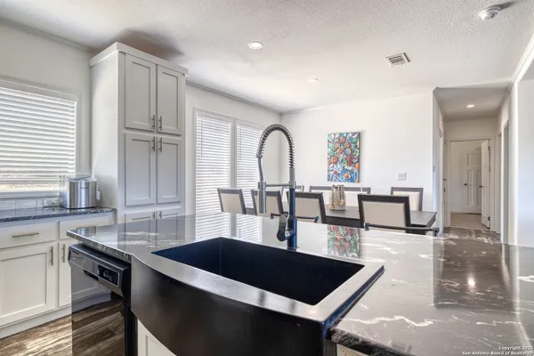 a view of a kitchen area with furniture and window