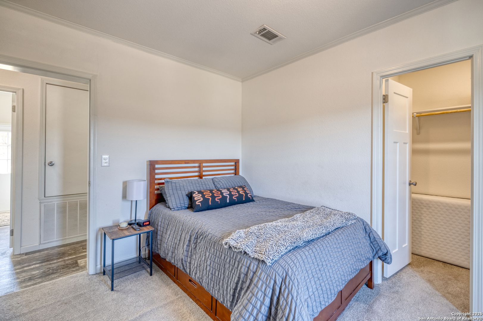 3049 North Little Creek Road Utopia, TX 78884 - Photo 20 of 38 a bedroom with a bed and a cabinets