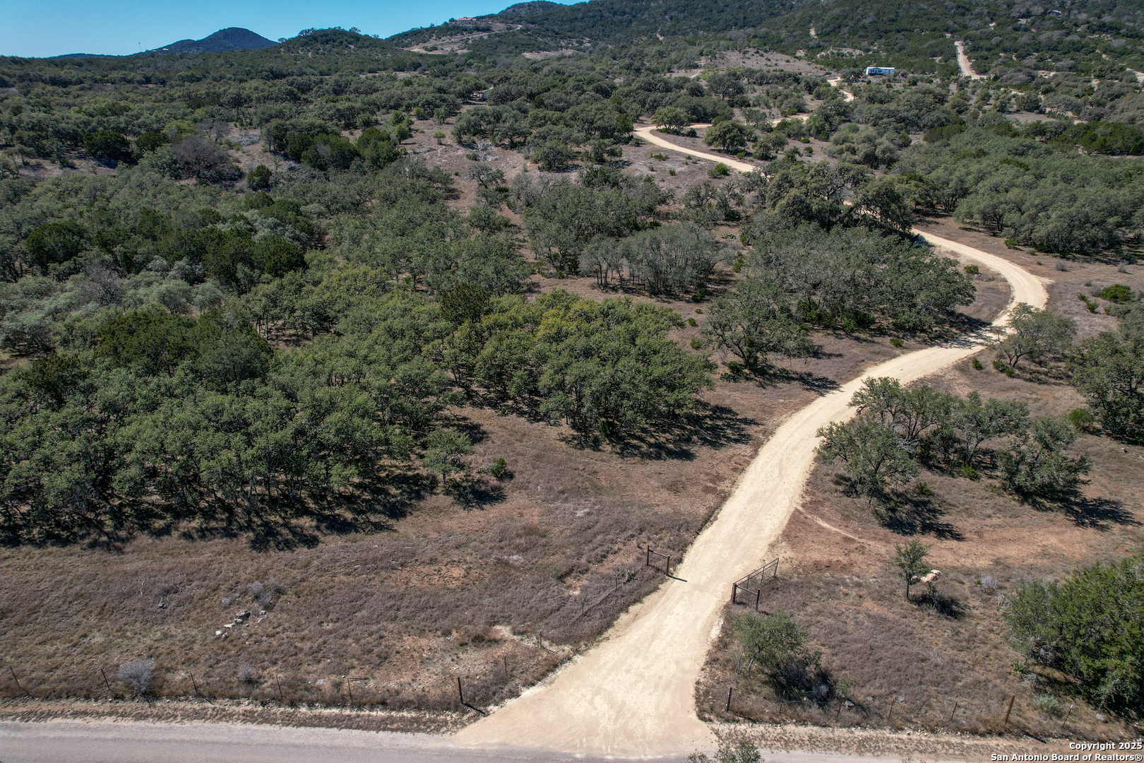 3049 North Little Creek Road Utopia, TX 78884 - Photo 3 of 38 a view of a yard with mountain