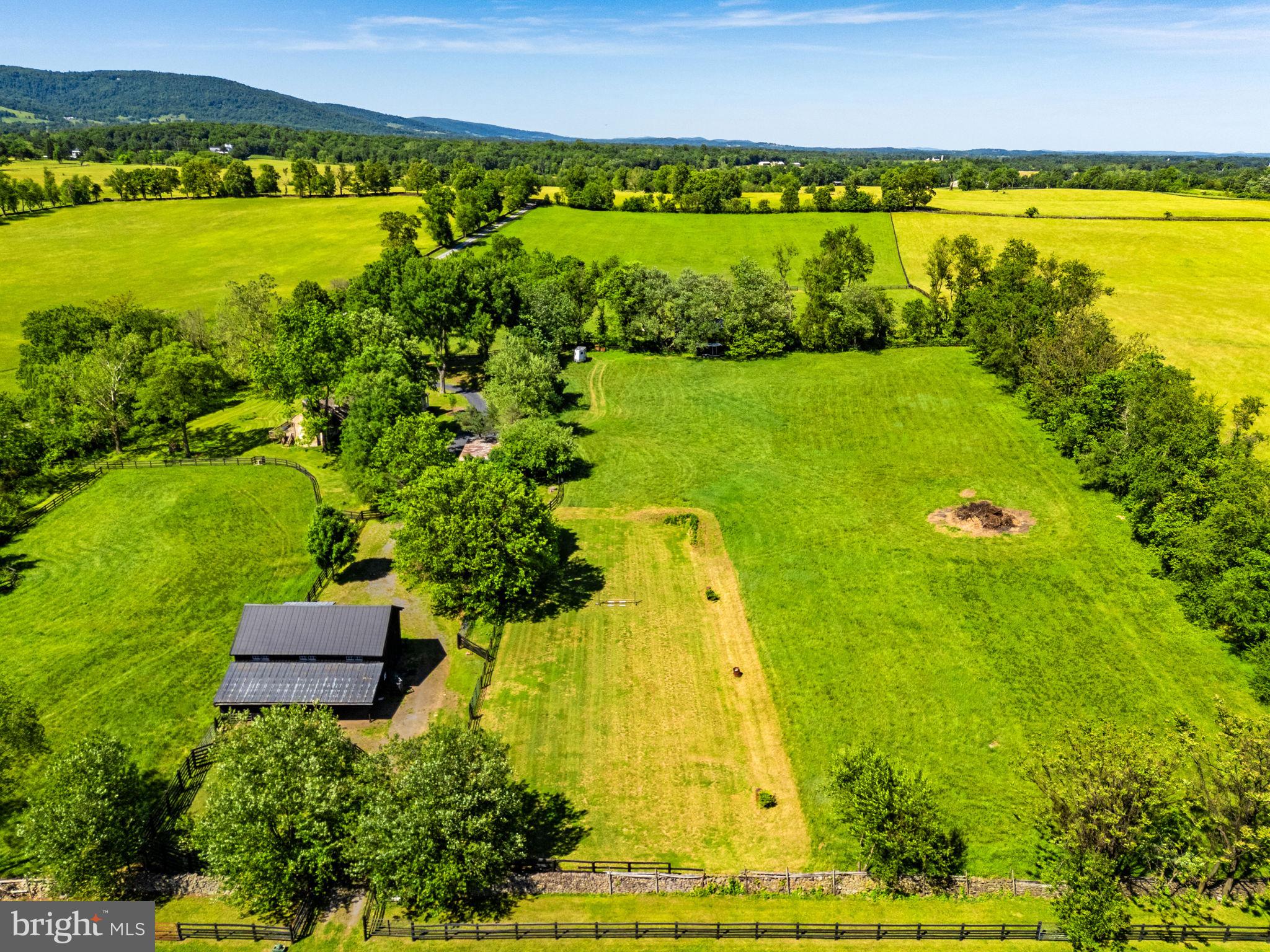 33195 Millville Road Upperville, VA 20184 - Photo 56 of 76 View of barn and house with riding ring & pastures