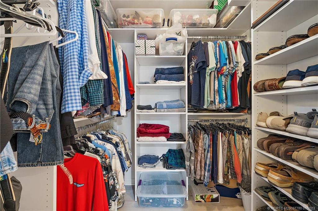 8 North River Road Stuart, FL 34996 - Photo 21 of 42 a view of walk in closet with clothes and shoes