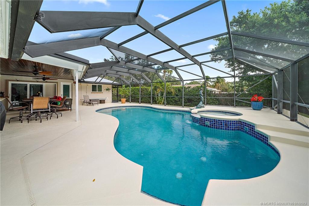 8 North River Road Stuart, FL 34996 - Photo 4 of 42 a view of a swimming pool with sitting area
