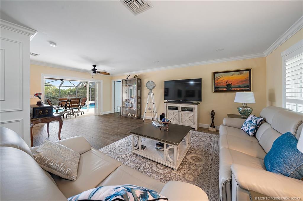 8 North River Road Stuart, FL 34996 - Photo 6 of 42 a living room with furniture and a flat screen tv