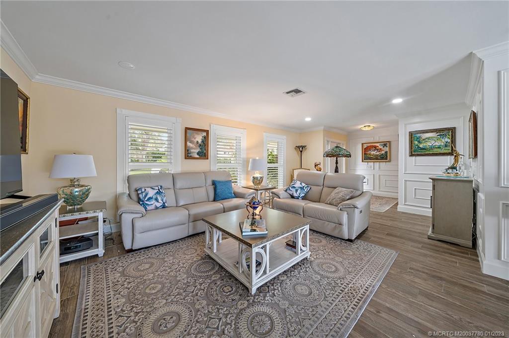 8 North River Road Stuart, FL 34996 - Photo 8 of 42 a living room with furniture and a couch