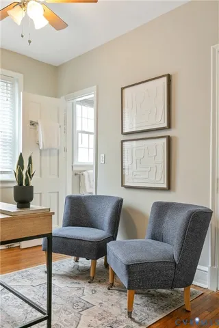 a living room with furniture and a window