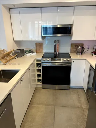 a kitchen with a stove and a sink