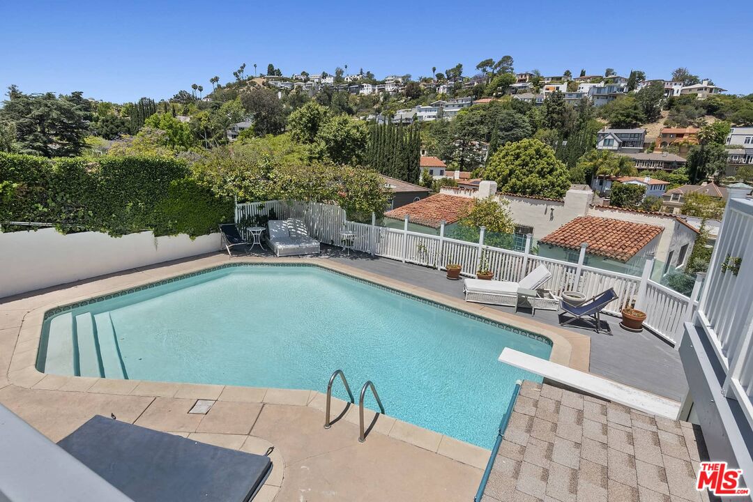 a view of a swimming pool with a patio