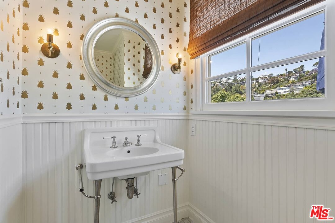 3347 Ley Drive Los Angeles, CA 90027 - Photo 16 of 25 a bathroom with a sink and a mirror