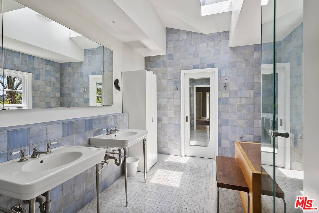 3347 Ley Drive Los Angeles, CA 90027 - Photo 18 of 25 a bathroom with a sink and a mirror