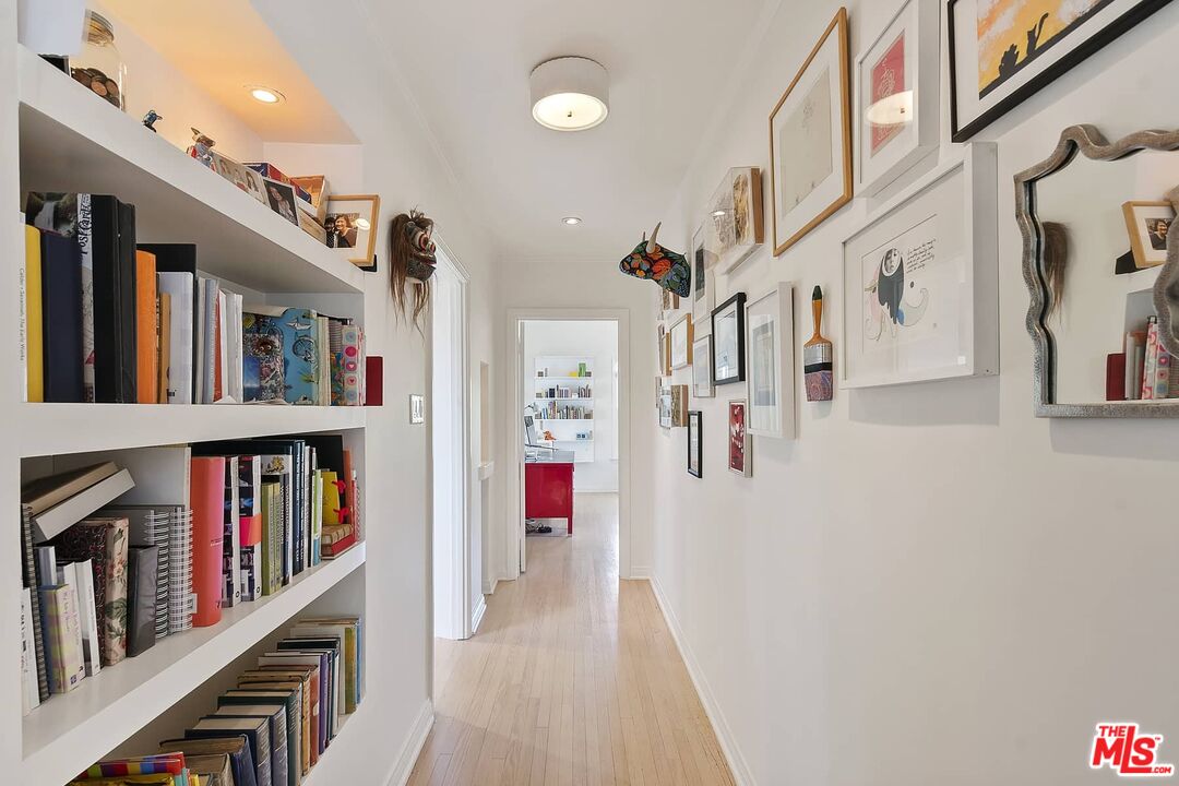 3347 Ley Drive Los Angeles, CA 90027 - Photo 20 of 25 a hallway with a book shelf and a book shelf
