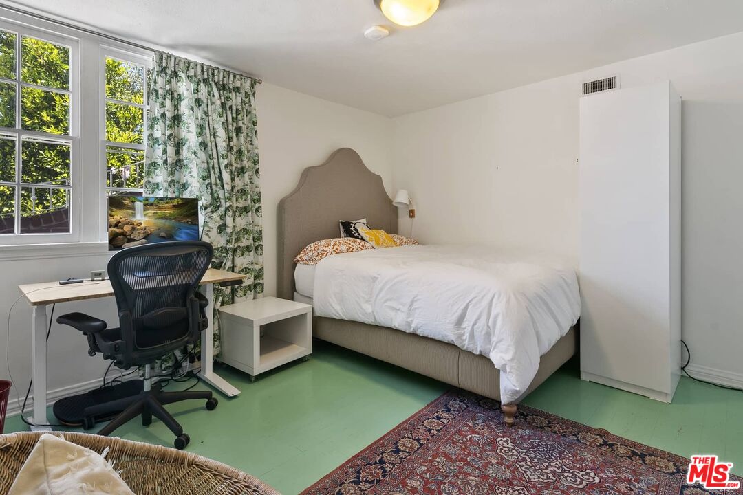 3347 Ley Drive Los Angeles, CA 90027 - Photo 25 of 25 a bedroom with a bed and a chair