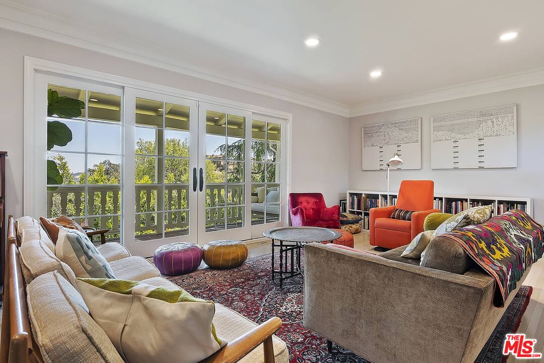 3347 Ley Drive Los Angeles, CA 90027 - Photo 6 of 25 a living room filled with furniture and a floor to ceiling window