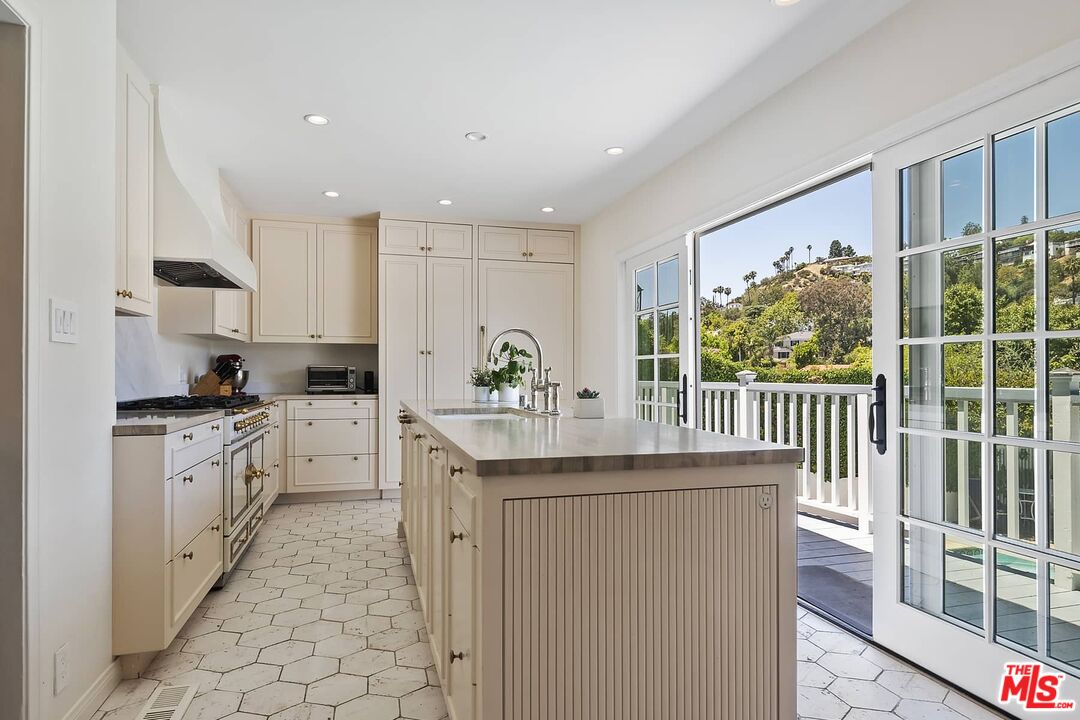 3347 Ley Drive Los Angeles, CA 90027 - Photo 10 of 25 a kitchen with counter top space sink and cabinets