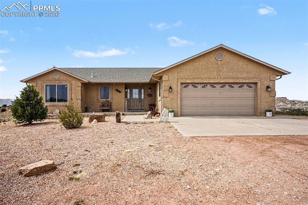 459 Bowie Road Penrose, CO 81240 - Photo 2 of 47 The front yard offers ample space and privacy, blending seamlessly with the surrounding open acreage.