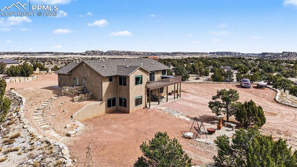 459 Bowie Road Penrose, CO 81240 - Photo 38 of 47 Enjoy breathtaking Colorado sunsets from the Trex deck, hot tub, and back patios or front where expansive views of the mountains and open space create the perfect backdrop for relaxation and outdoor entertaining.