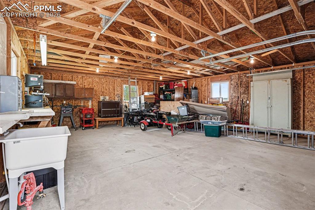 459 Bowie Road Penrose, CO 81240 - Photo 42 of 47 The detached 2-car heated garage/shop is fully equipped with water, electricity, heat, a utility sink, and a 220V outlet, making it ideal for projects, hobbies, equipment storage, or workshop use.