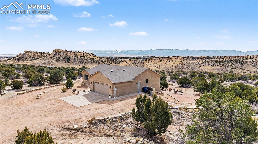 459 Bowie Road Penrose, CO 81240 - Photo 5 of 47 property showcases nearly 40 acres of open land, with the custom stucco ranch home centrally located for privacy and panoramic mountain views