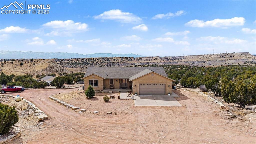 459 Bowie Road Penrose, CO 81240 - Photo 6 of 47 property showcases nearly 40 acres of open land, with the custom stucco ranch home centrally located for privacy and panoramic mountain views