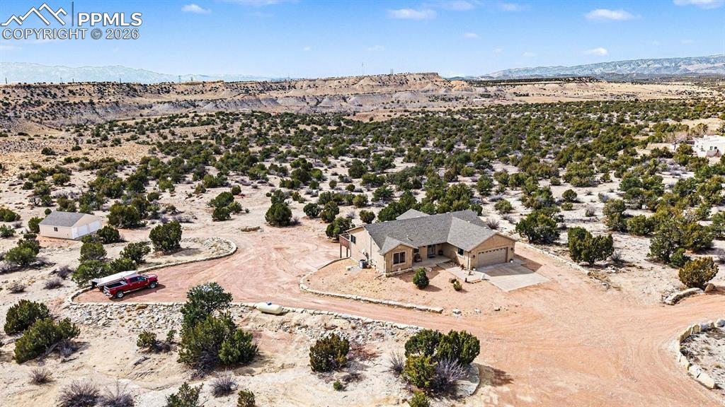 459 Bowie Road Penrose, CO 81240 - Photo 7 of 47 property showcases nearly 40 acres of open land, with the custom stucco ranch home centrally located for privacy and panoramic mountain views