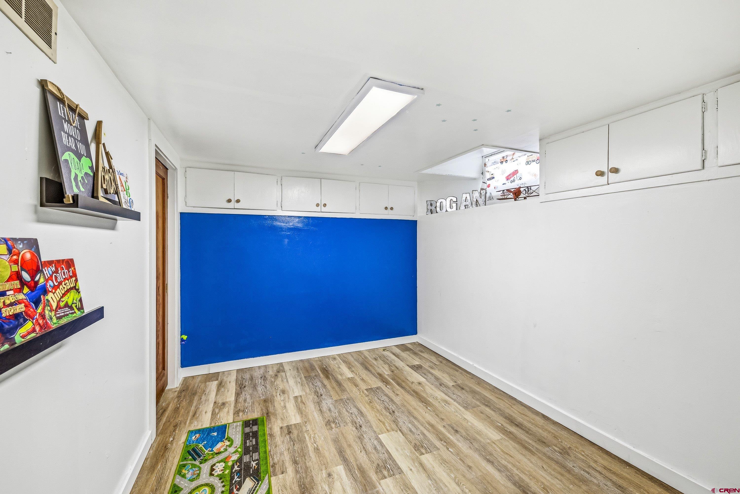 325 East 3rd Street Delta, CO 81416 - Photo 16 of 23 a view of empty room with wooden floor