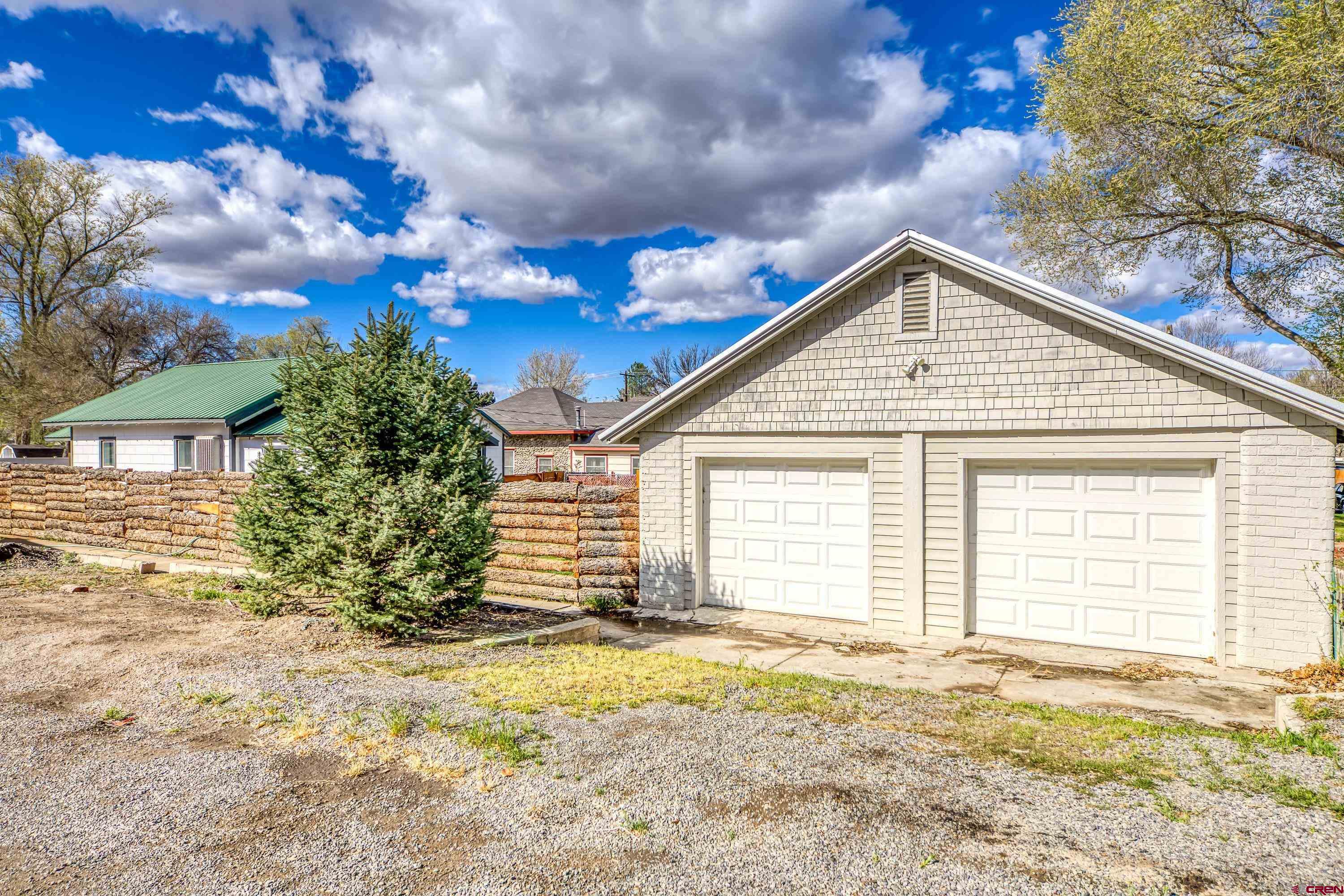 325 East 3rd Street Delta, CO 81416 - Photo 4 of 23 a view of a house with a backyard