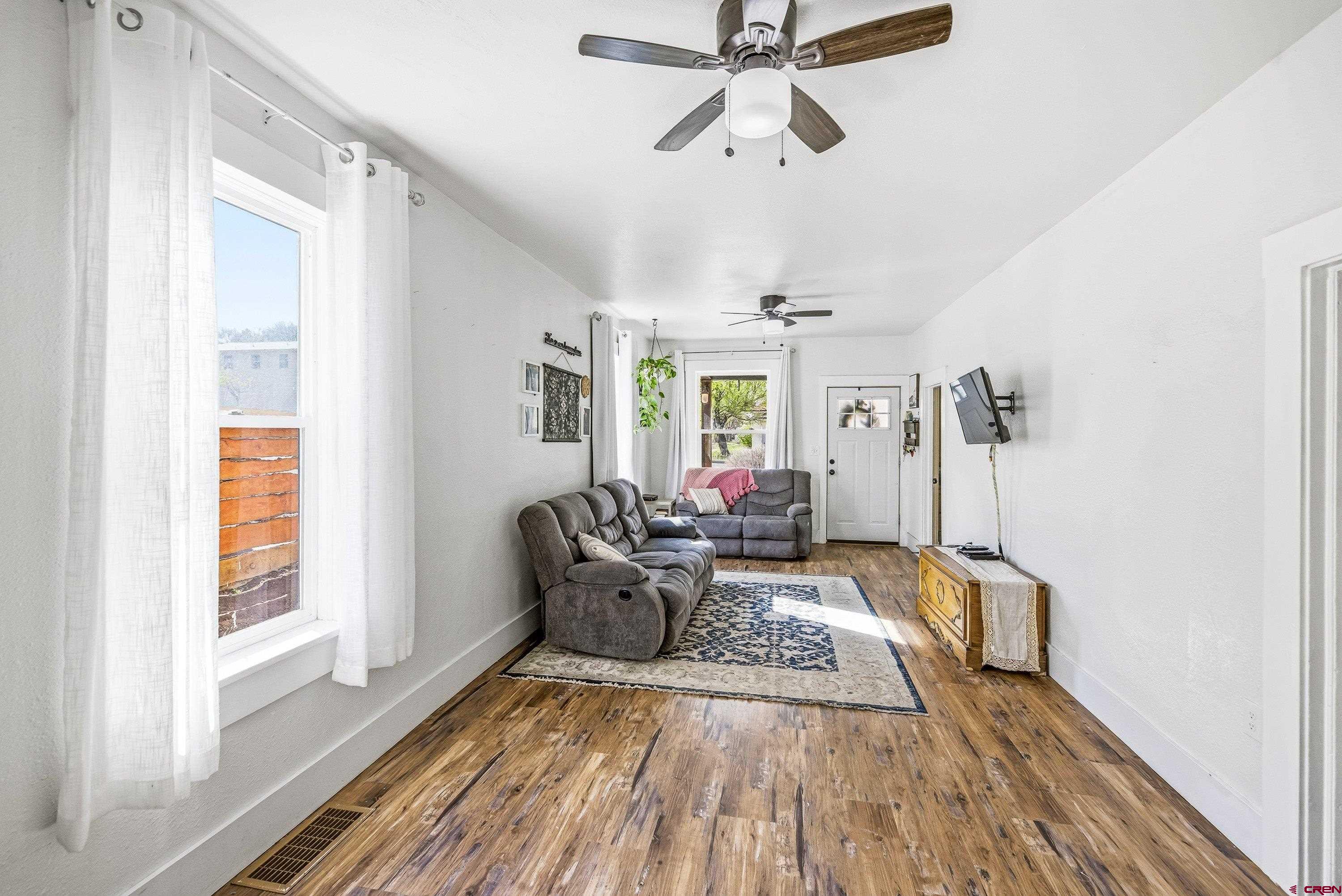325 East 3rd Street Delta, CO 81416 - Photo 5 of 23 a living room with furniture and a window