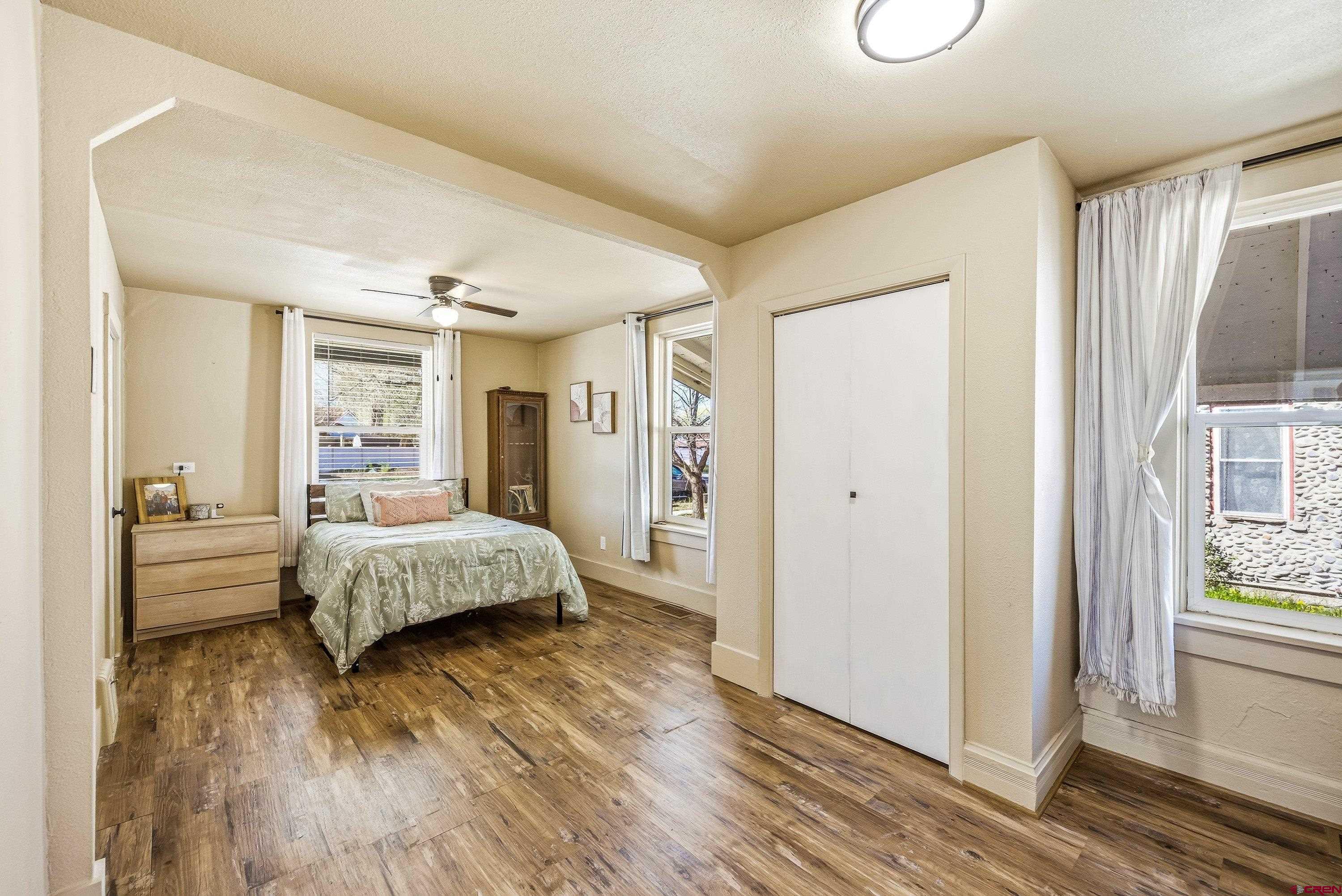 325 East 3rd Street Delta, CO 81416 - Photo 9 of 23 a spacious bedroom with a bed and a large window