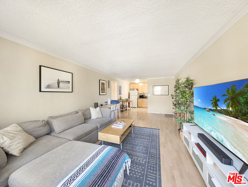 440 Raymond Avenue, Unit 1 Santa Monica, CA 90405 - Photo 1 of 14 a living room with furniture and a flat screen tv