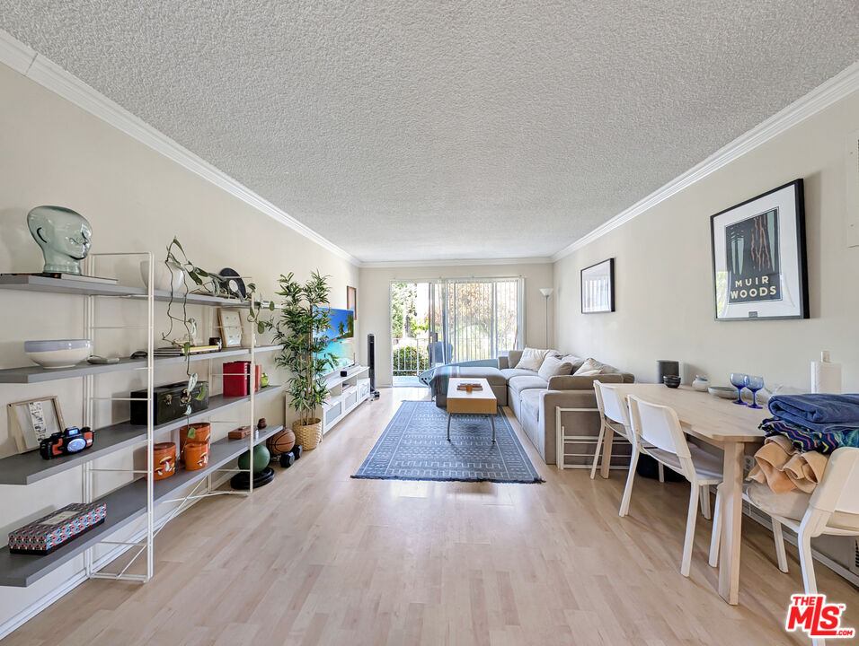 440 Raymond Avenue, Unit 1 Santa Monica, CA 90405 - Photo 13 of 14 a living room with furniture and a wooden floor