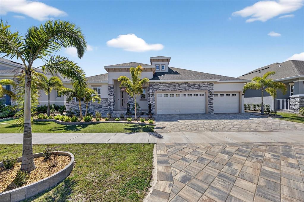 994 Signet Drive Apollo Beach, FL 33572 - Photo 87 of 98 a view of a house with a swimming pool and a yard
