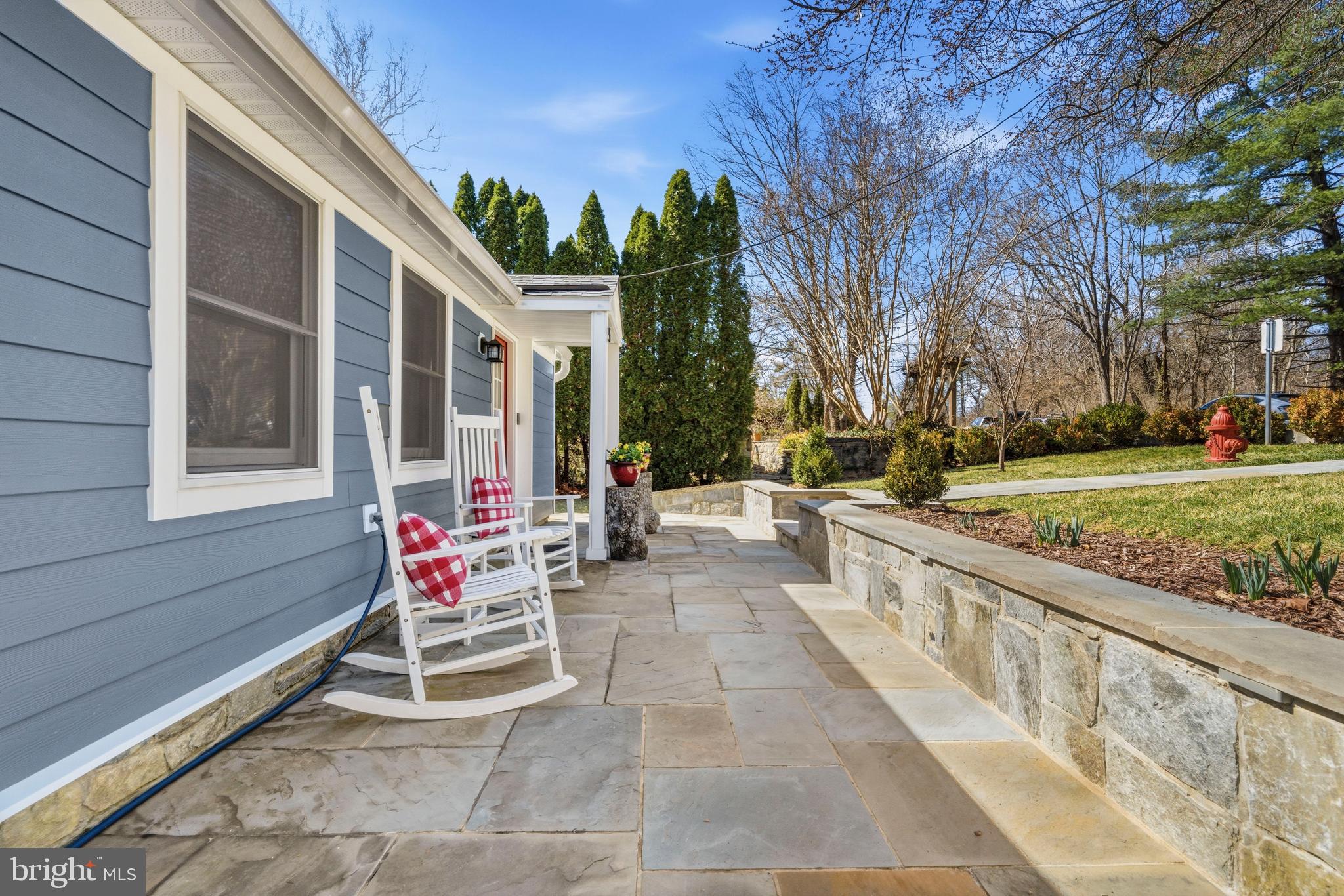 5 Ericsson Road Cabin John, MD 20818 - Photo 29 of 56 a view of a patio with a table and chairs and potted plants