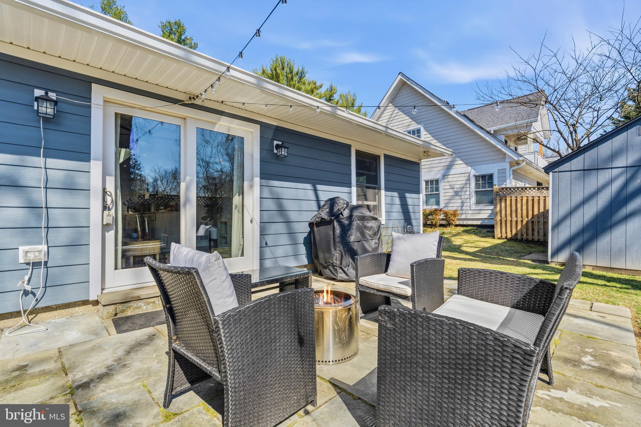 5 Ericsson Road Cabin John, MD 20818 - Photo 36 of 56 a view of a patio with table and chairs and potted plants