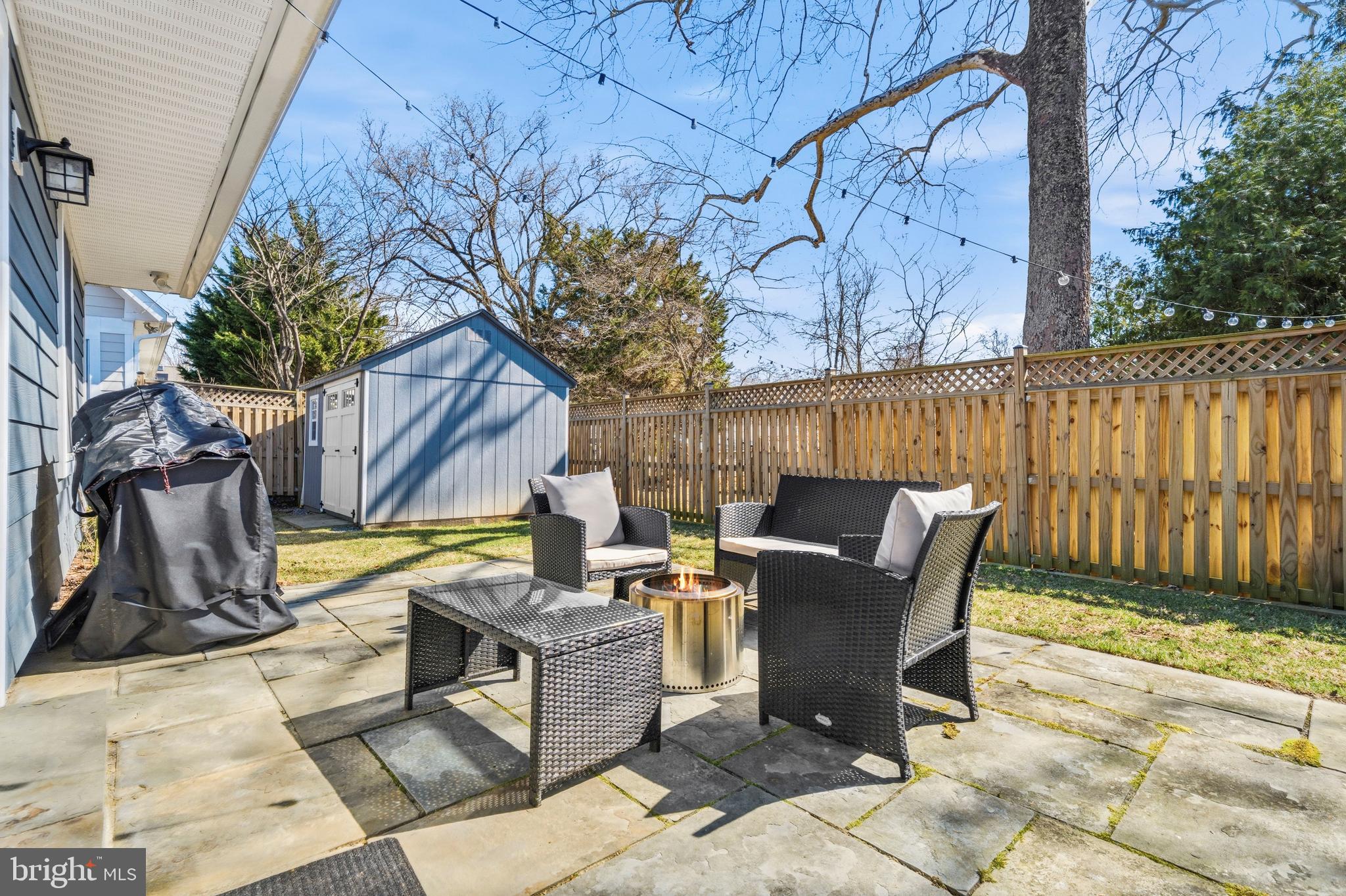 5 Ericsson Road Cabin John, MD 20818 - Photo 37 of 56 a view of a patio with a table and chairs