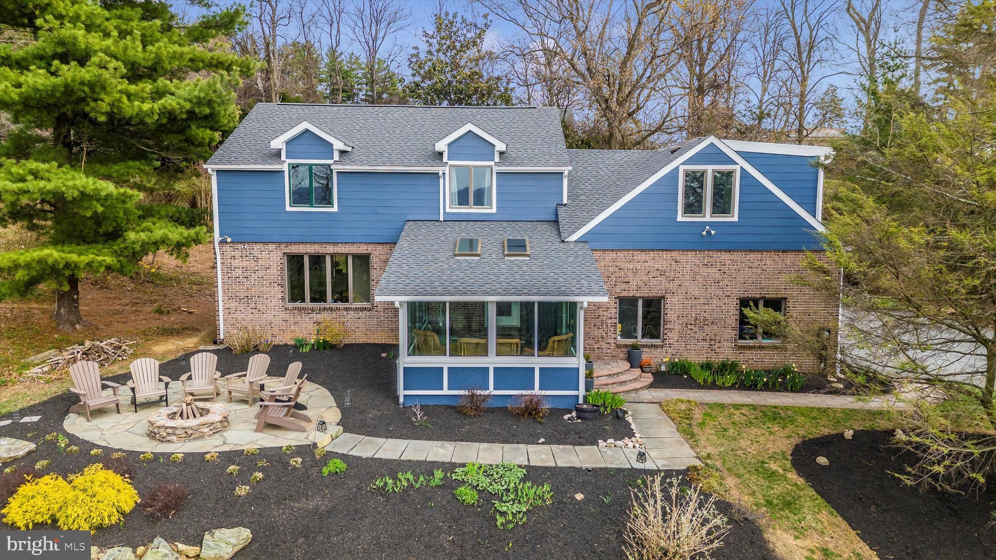4426 Teen Barnes Road Frederick, MD 21703 - Photo 1 of 76 a front view of a house with a yard and garage