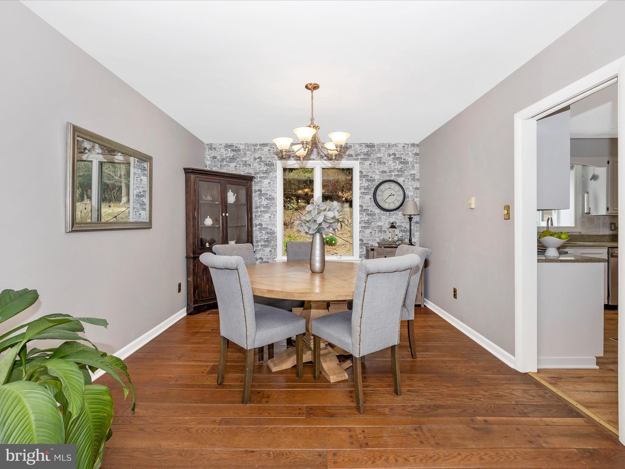 4426 Teen Barnes Road Frederick, MD 21703 - Photo 12 of 76 a view of a dining room with furniture wooden floor and chandelier