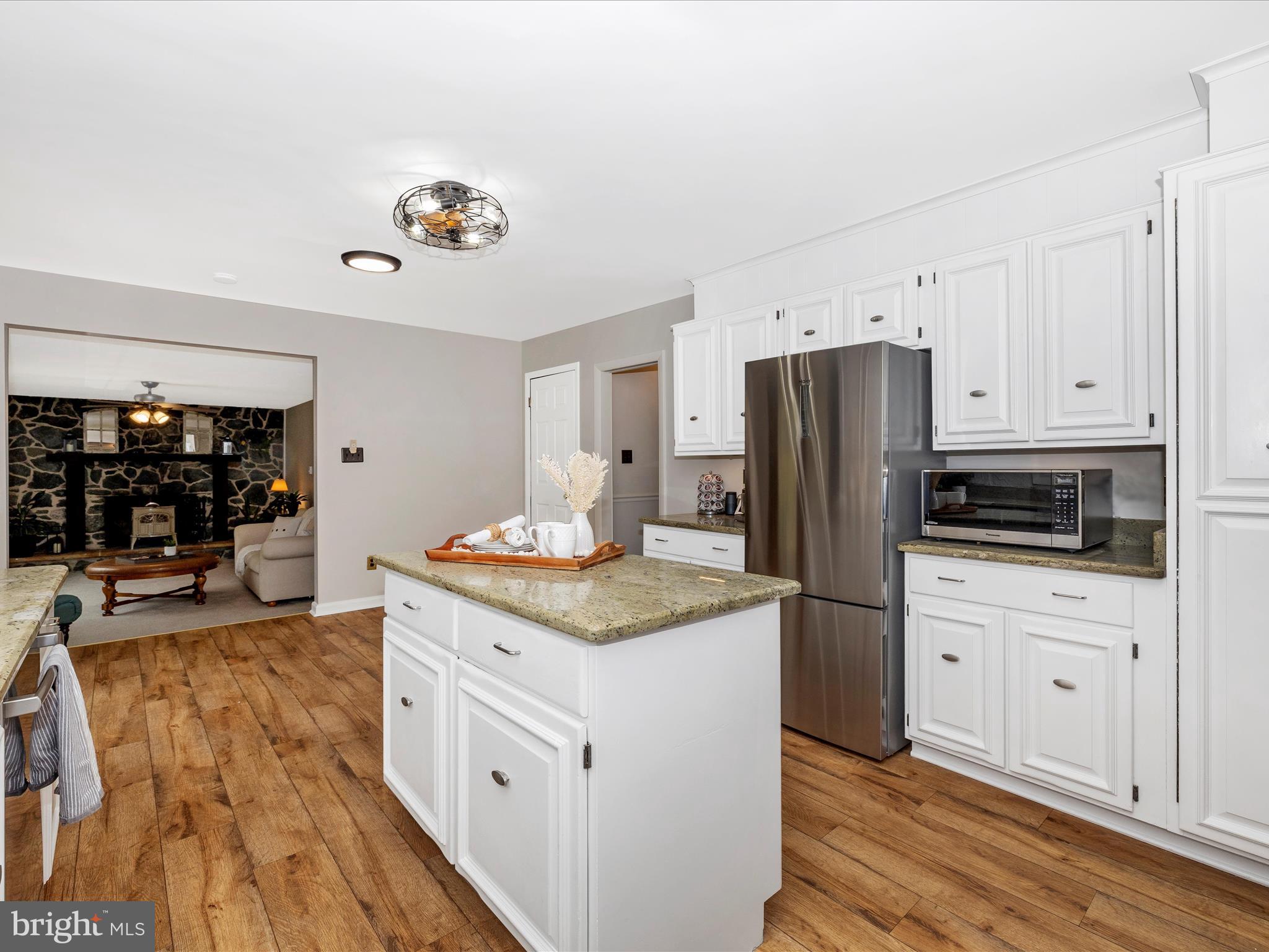 4426 Teen Barnes Road Frederick, MD 21703 - Photo 19 of 76 a kitchen with stainless steel appliances granite countertop a refrigerator and a stove top oven