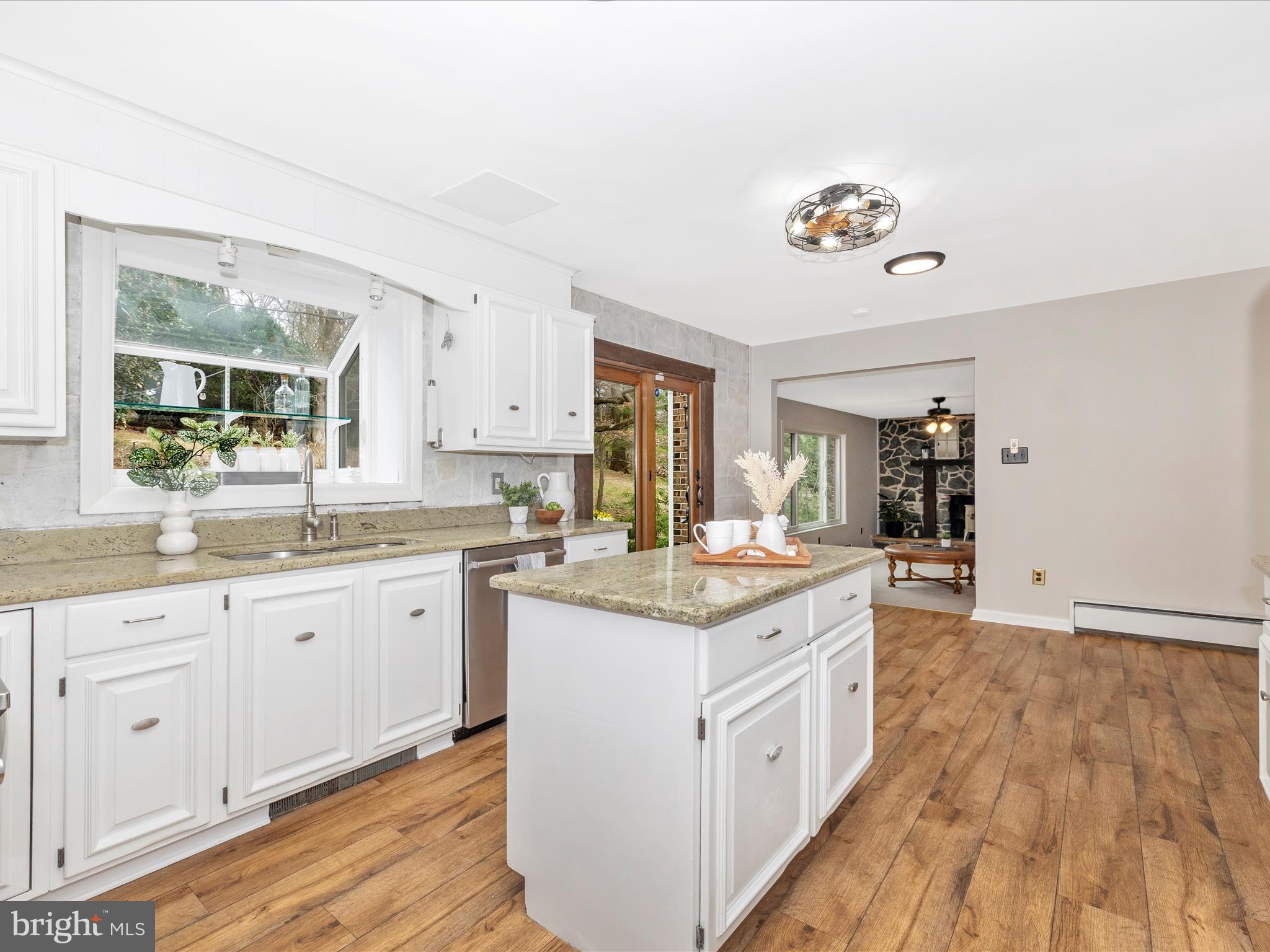 4426 Teen Barnes Road Frederick, MD 21703 - Photo 20 of 76 a kitchen with a white cabinets and chandelier